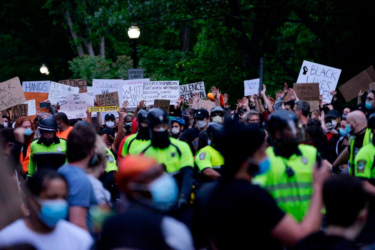 Protesters confront a row of police officers at a demonstration in Franklin Park in Boston, Mass., on June 2, 2020. (Joseph Prezioso/AFP via Getty Images)