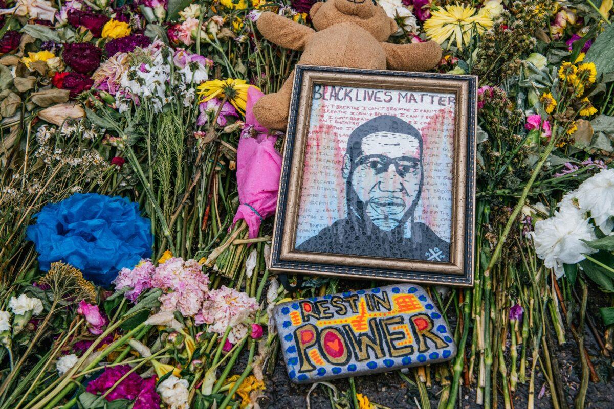 Flowers and messages are placed at the memorial for George Floyd in Minneapolis, Minn. on June 9, 2020. (Brandon Bell/Getty Images)