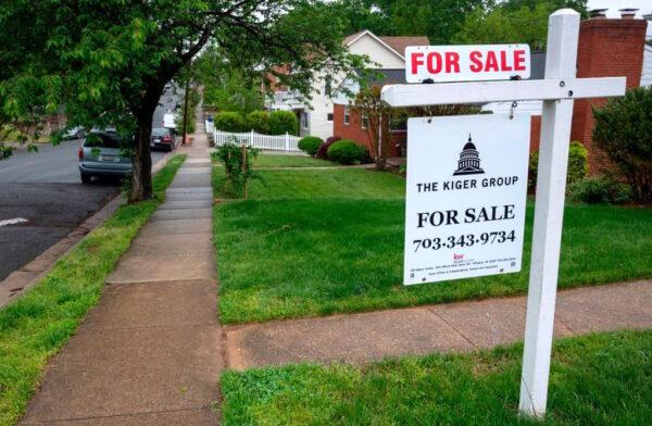 A "For Sale" sign is in front of a house in Arlington, Va., on May 6, 2020. (Andrew Caballero-Reynolds/AFP/Getty Images)