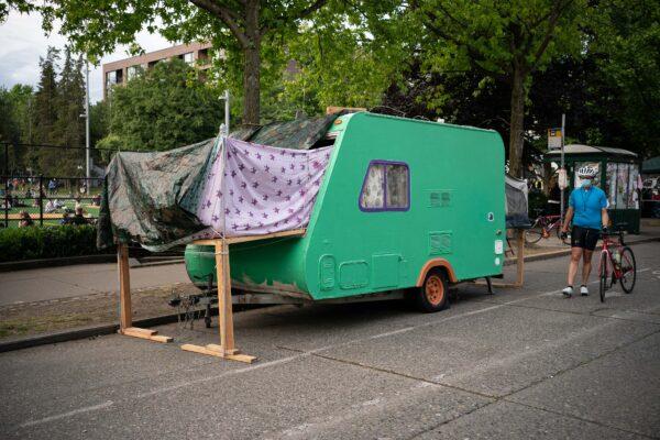 A person walks by a camping trailer in the so-called "Capitol Hill Autonomous Zone" in Seattle, Wash., on June 10, 2020.  (David Ryder/Getty Images)