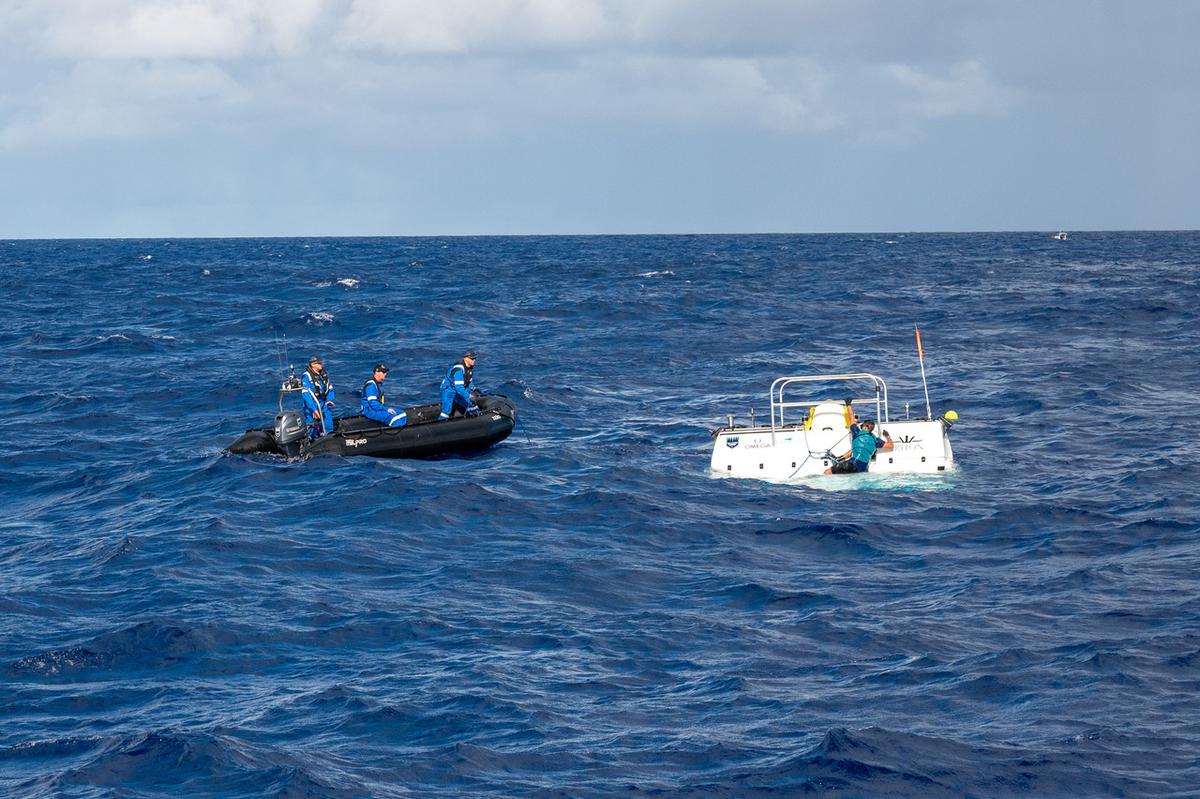 Limiting Factor deep-sea submersible vehicle attended to by surface crew (Courtesy of Enrique Alvarez and <a href="https://www.eyos-expeditions.com/">EYOS Expeditions</a>)