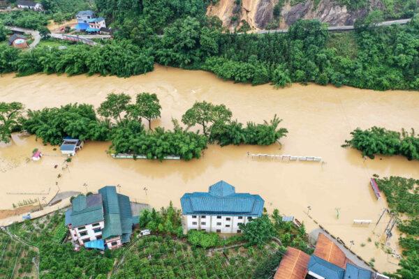 Fields and inundated buildings submerged in flood in Rong'an County in China's southern Guangxi region on June 10, 2020. (STR/AFP via Getty Images)