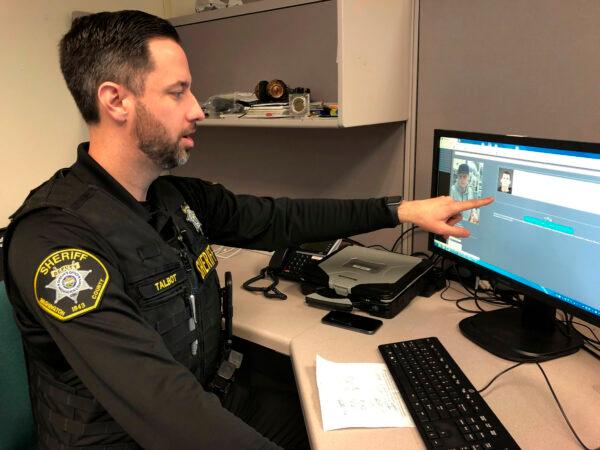 Washington County Sheriff's Office Deputy Jeff Talbot demonstrates how his agency used facial recognition software to help solve a crime, at their headquarters in Hillsboro, Ore., on Feb. 22, 2019. (Gillian Flaccus/AP Photo)