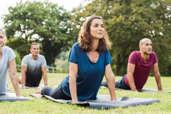 A group of people practicing yoga in this file photo. (Rido/Shutterstock)