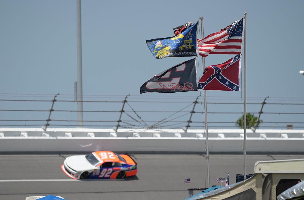 American, Confederate, and Dale Earnhardt Sr. and Jr. flags fly near Turn 4 during NASCAR qualifying at Daytona International Speedway in Daytona Beach, Fla., on July 4, 2015. (Phelan M. Ebenhack/AP Photo)