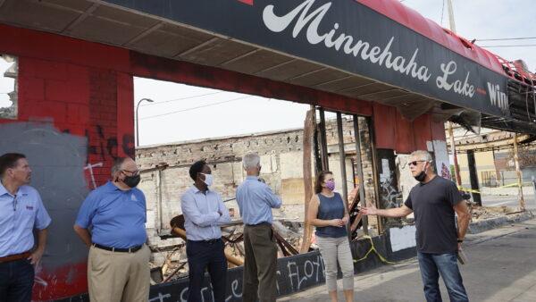 Steve Krause, owner of Minnehaha Lake Wine & Spirit, talk at a small gathering in front of his shop that was burned down in the riots following the May 25 death of George Floyd, in Minneapolis, Minn., on June 9, 2020. (Meiling Lee/The Epoch Times)