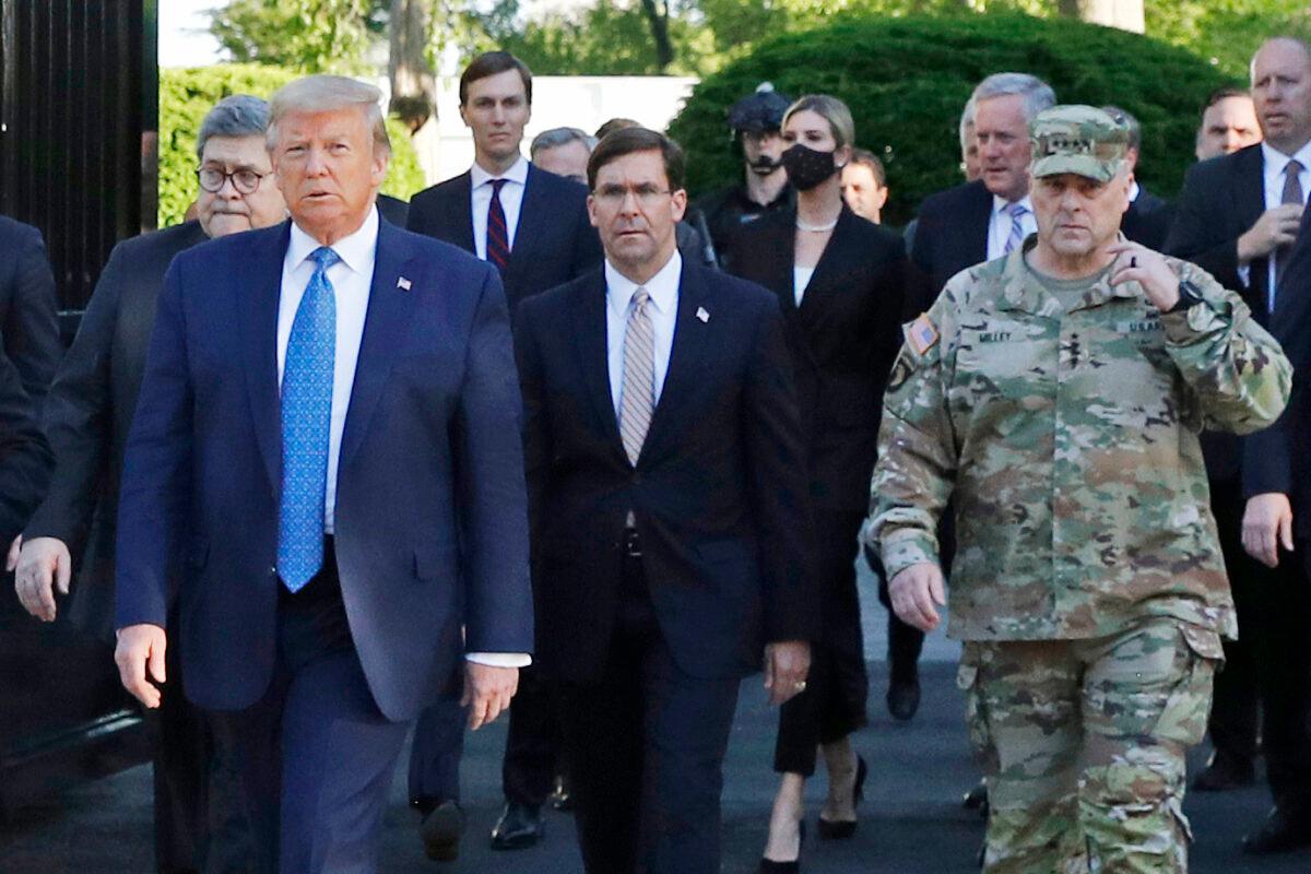 Then-President Donald Trump departs the White House to visit outside St. John's Church, with Secretary of Defense Mark Esper, center, Joint Staffs chairman Mark Milley, right, and other officials, in Washington on June 1, 2020. (Patrick Semansky/AP Photo)