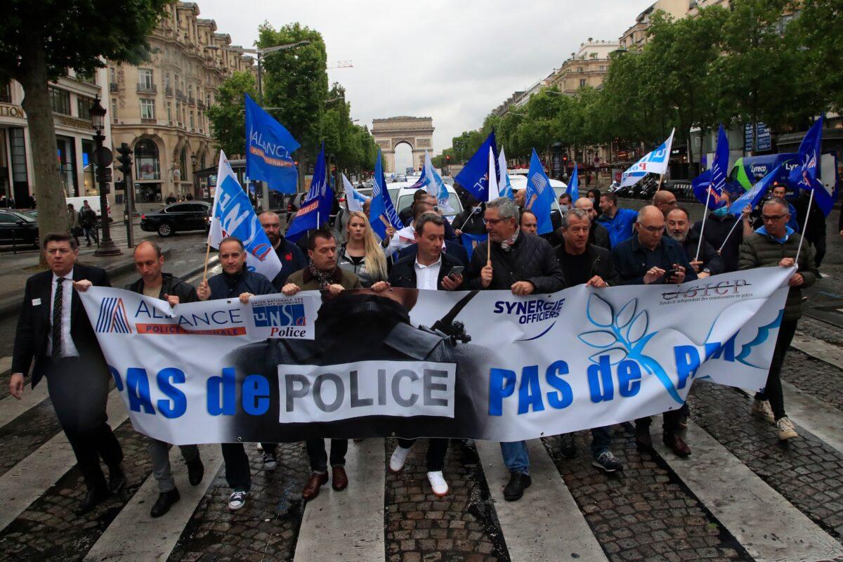 French police unionists demonstrate with a banner reading "No police, no peace" down the Champs-Elysee avenue, in Paris, France, on June 12, 2020. (Michel Euler/AP Photo)