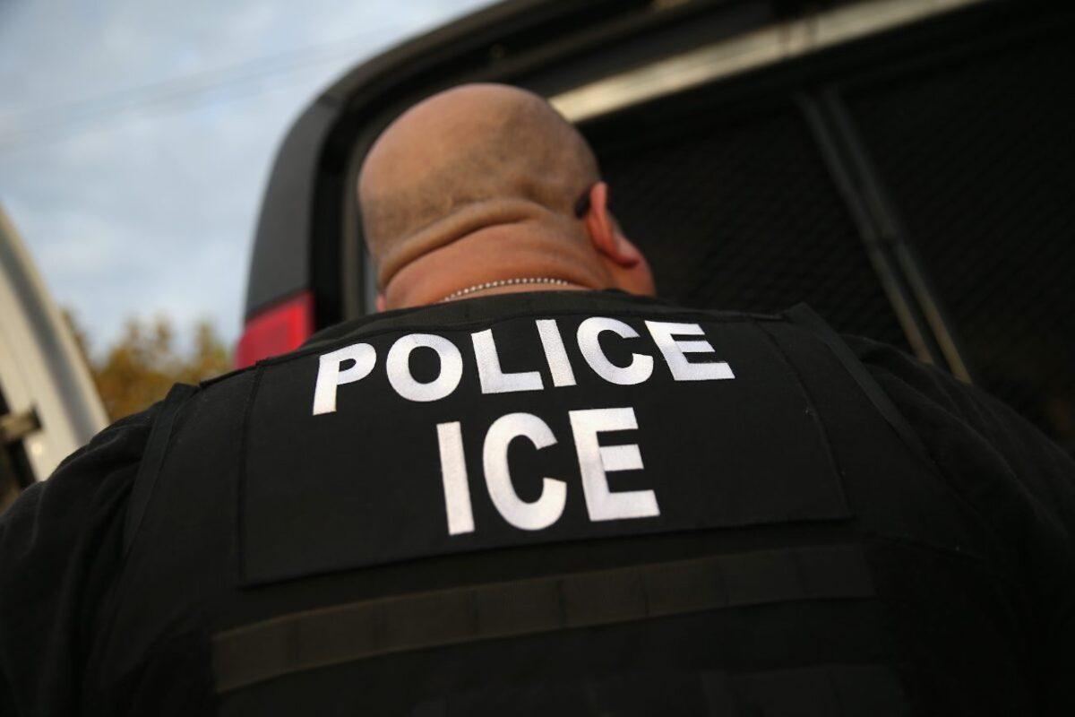 An Immigration and Customs Enforcement (ICE) agent detains a convicted criminal alien in Los Angeles, Calif., on Oct. 14, 2015. (John Moore/Getty Images)