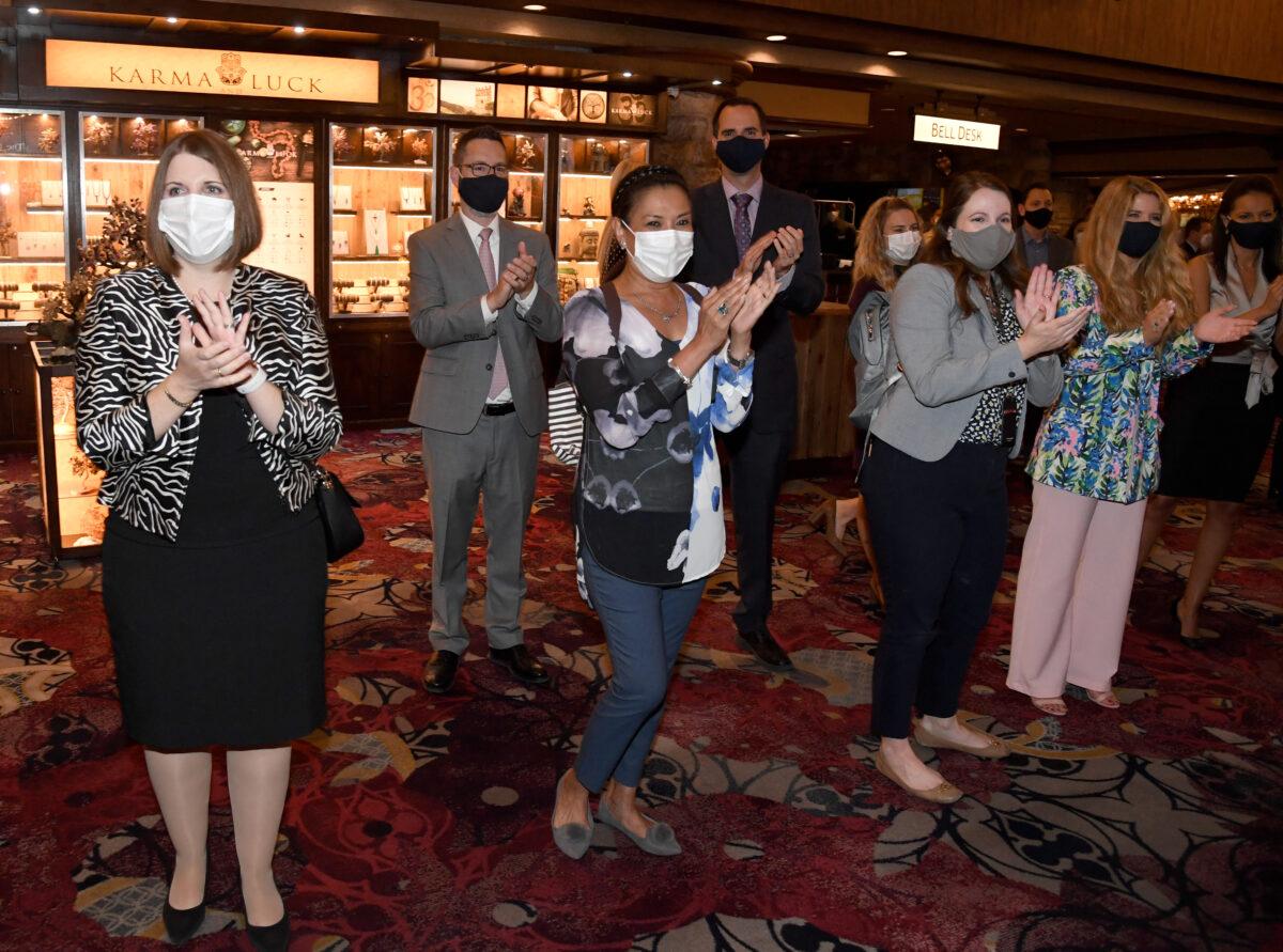 Excalibur Hotel & Casino employees line up and applaud as guests are let into the Las Vegas Strip property for the first time since being closed in mid-March amid the COVID-19 pandemic in Las Vegas, Nev., on June 11, 2020. (Ethan Miller/Getty Images)