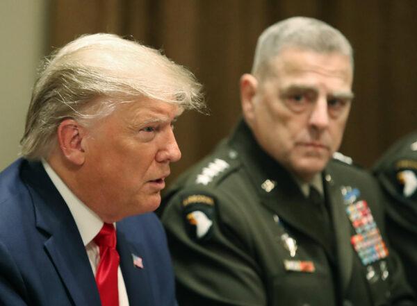 Then-President Donald Trump speaks as Joint Chiefs of Staff Chairman Army Gen. Mark Milley looks on, in Washington on Oct. 7, 2019. (Mark Wilson/Getty Images)