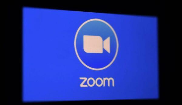 A Zoom App logo is displayed on a smartphone. (Olivier Douliery/AFP via Getty Images)