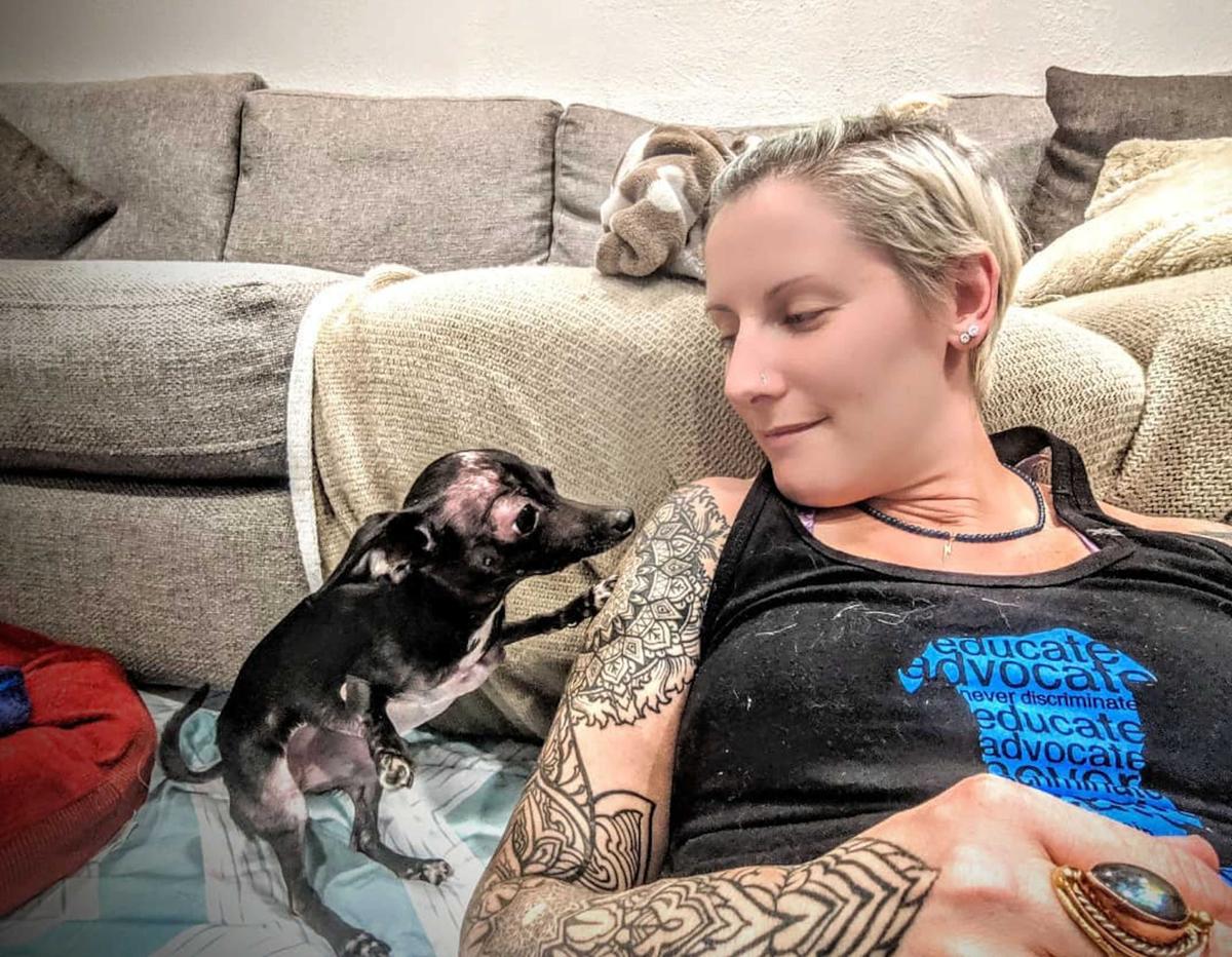 Chihuahua mix Freddie Mercury with loving owner Angela Adan, 31 (Caters News)