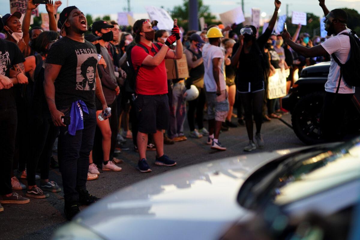 Protesters block a freeway during a rally against racial inequality and the police shooting death of Rayshard Brooks, in Atlanta, Georgia, on June 13, 2020. (Elijah Nouvelage/Reuters)