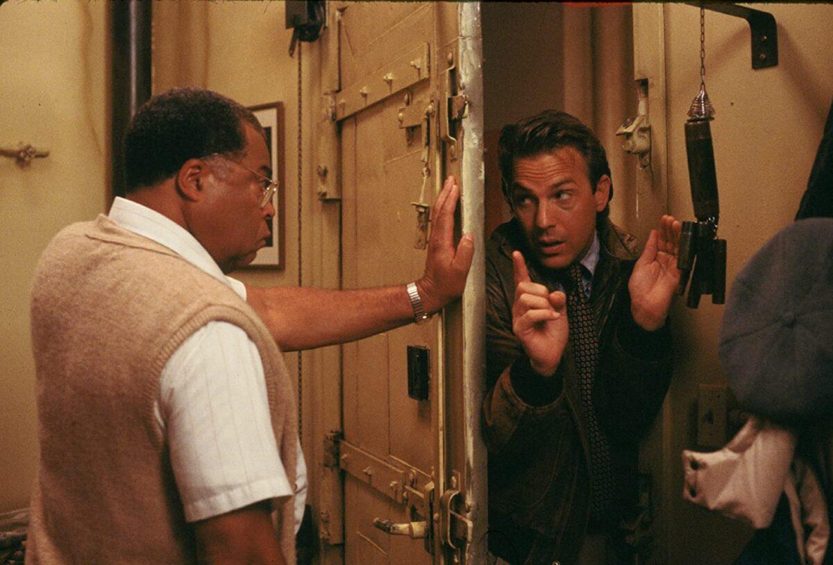 Ray (Kevin Costner, R) getting the door slammed on him by Terence Mann (James Earl Jones) in "Field of Dreams." (Universal Pictures)