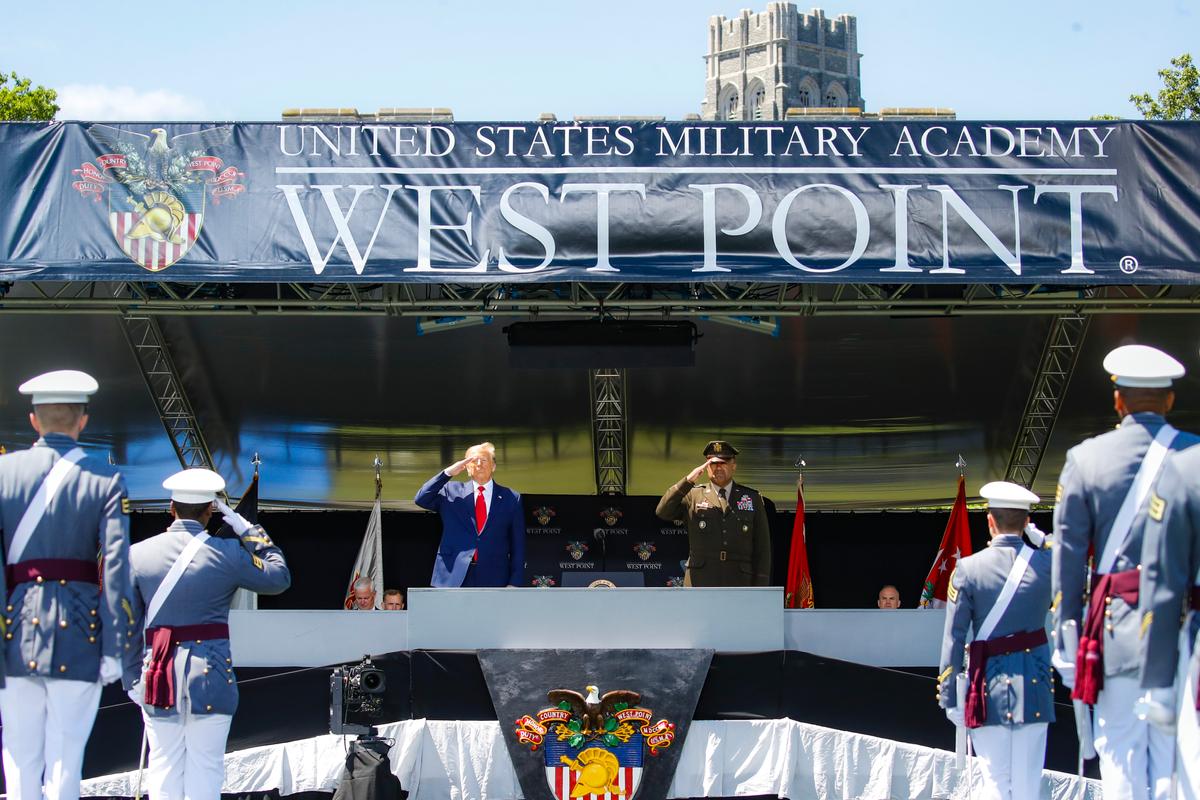President Donald Trump and U.S. Military Academy superintendent Darryl A. Williams salute graduating cadets during commencement ceremonies at Plain Parade Field at the United States Military Academy in West Point, N.Y., on June 13, 2020. (John Minchillo-Pool/Getty Images)