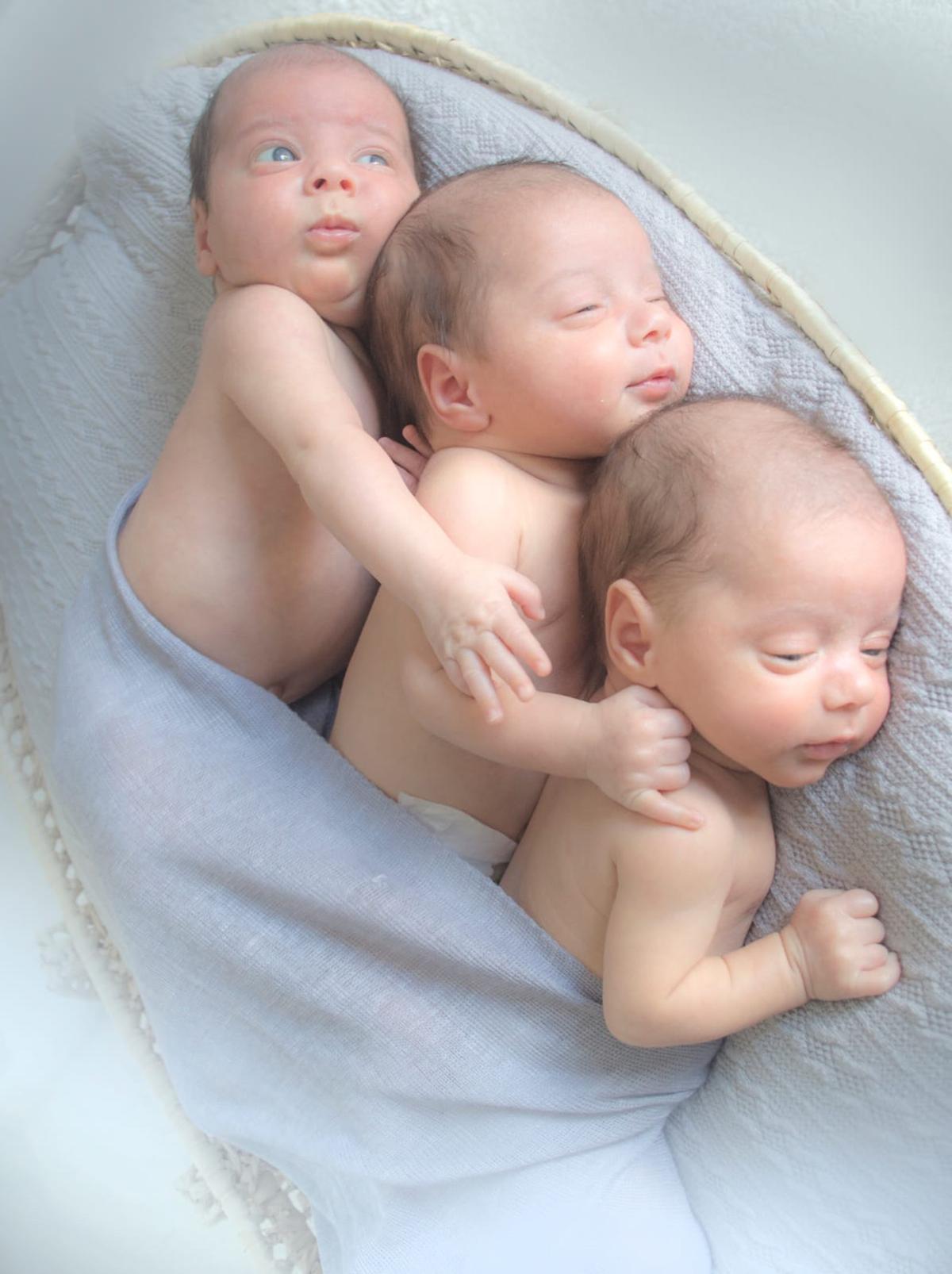 [L-R] The three identical triplets, Louis, Piero, and Remi. (Caters News)