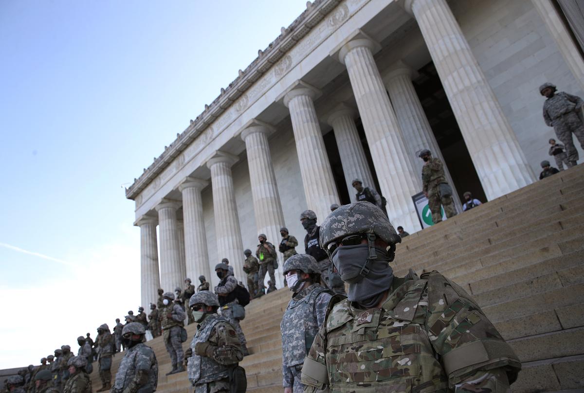Members of the D.C. National Guard stand on the steps of the Lincoln Memorial as demonstrators participate in a peaceful protest against police brutality and the death of George Floyd, on June 2, 2020, in Washington. (Win McNamee/Getty Images)