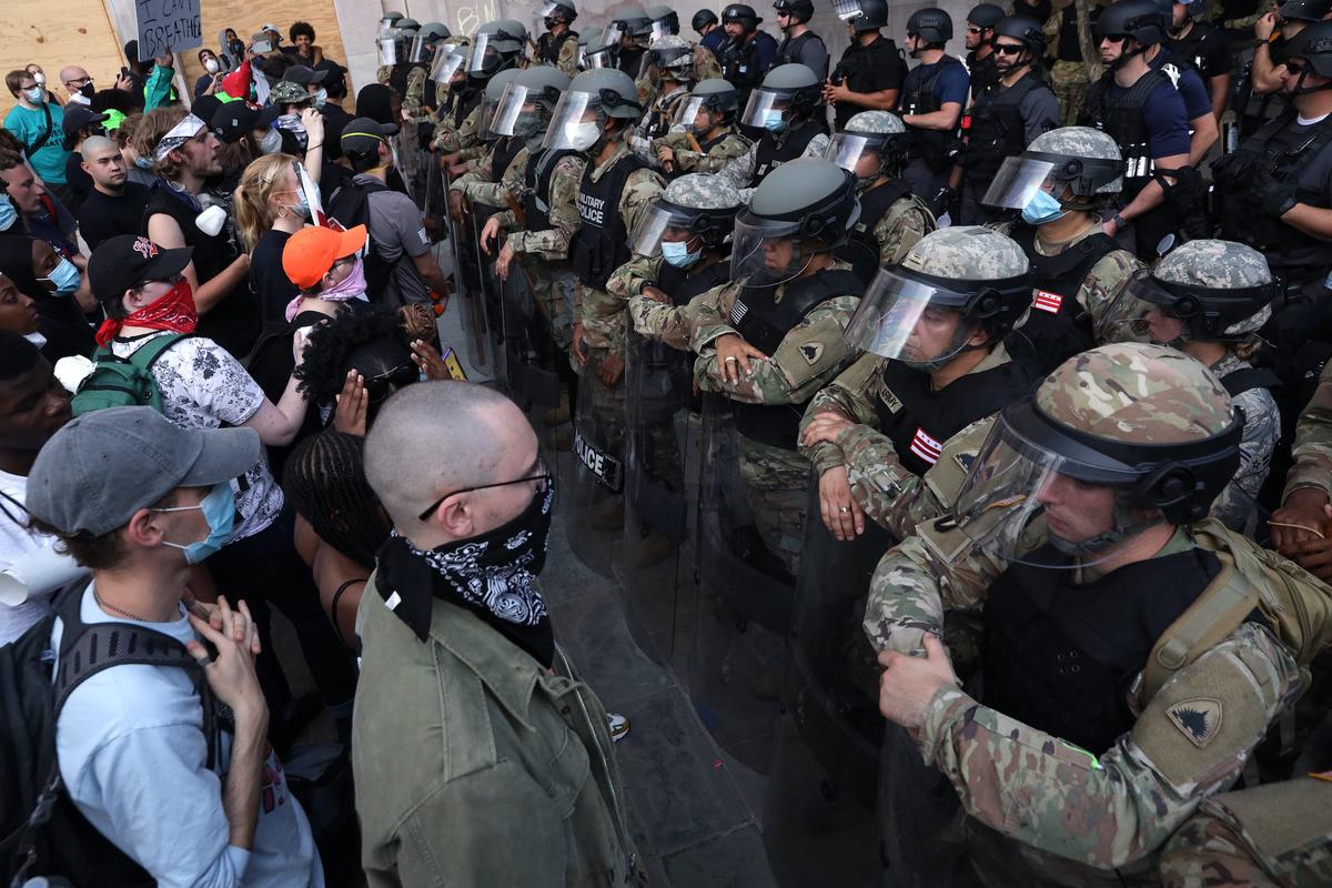 Demonstrators stand in front of D.C. National Guard during a peaceful protest against police brutality in Washington on June 3, 2020 (Alex Wong/Getty Images)