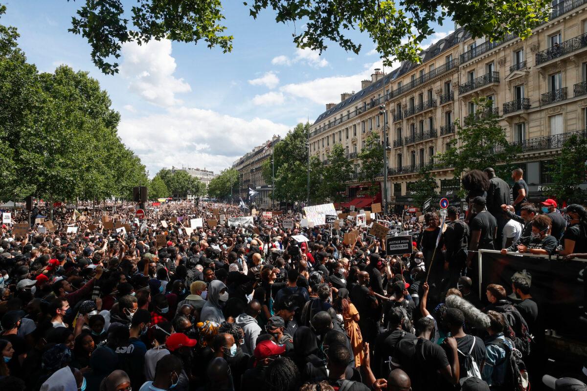 People at a demonstration against police brutality and racism in Paris, France, on June 13, 2020. (AP Photo/Thibault Camus)