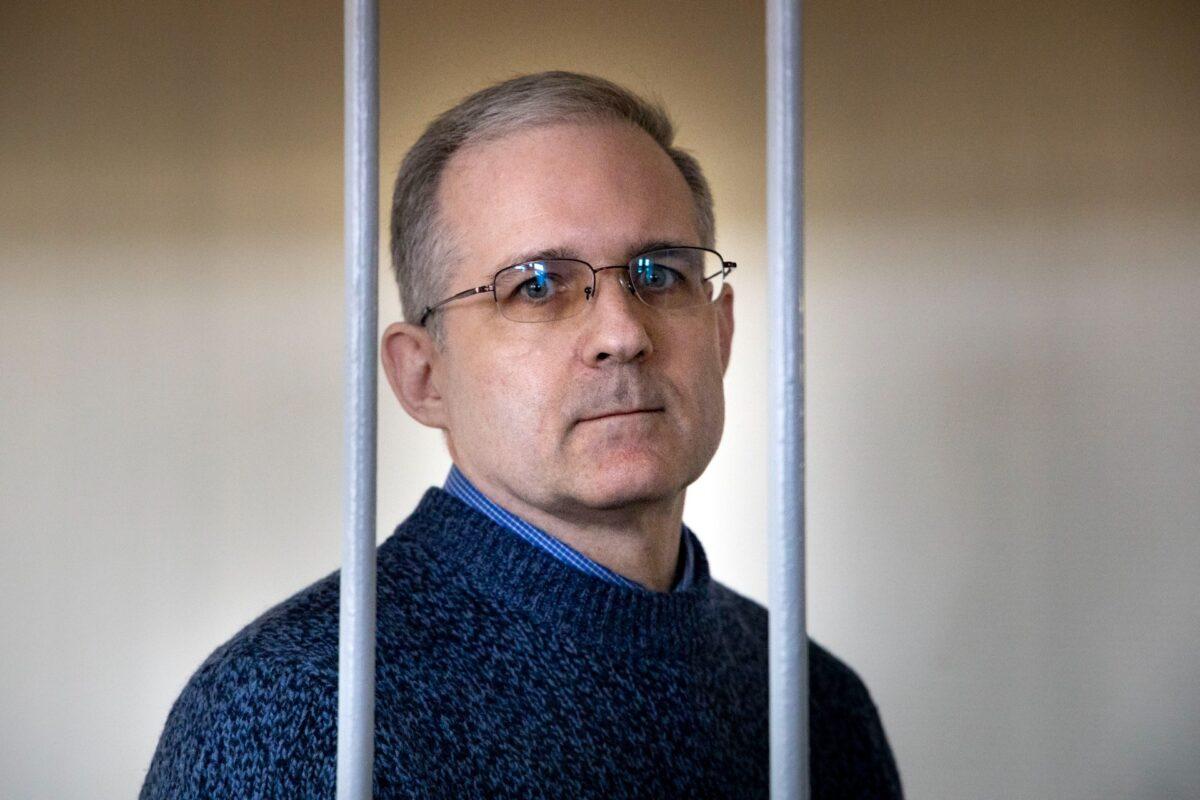 Paul Whelan, a former U.S. Marine who was arrested for alleged spying by Russia on Dec. 28, 2018, stands in a cage as he waits for a hearing in a courtroom in Moscow on Aug. 23, 2019. (Alexander Zemlianichenko/AP Photo)