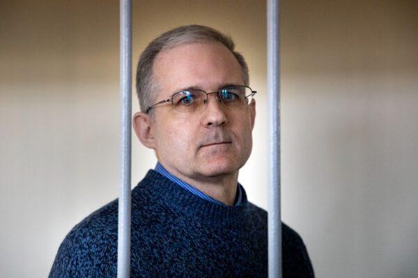 Paul Whelan, a former U.S. Marine who was arrested for alleged spying in Moscow on Dec. 28, 2018, stands in a cage as he waits for a hearing in a court room in Moscow on Aug. 23, 2019. (Alexander Zemlianichenko/AP Photo)
