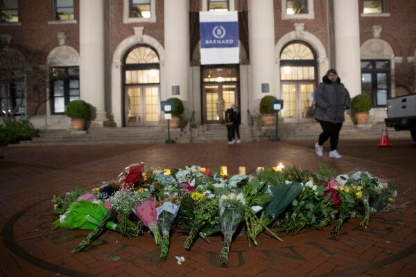 A woman walks past a make-shift memorial for Tessa Majors inside the Barnard campus in New York, on Dec. 12, 2019. (Mary Altaffer/AP Photo)