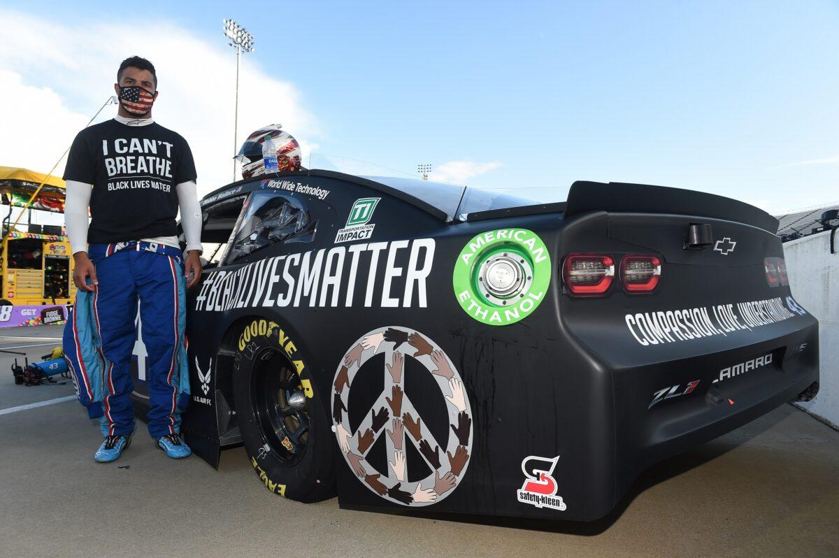Darrell "Bubba" Wallace, driver of the #43 Richard Petty Motorsports Chevrolet, stands next to his car painted with "#Black Lives Matter" prior to the NASCAR Cup Series Blue-Emu Maximum Pain Relief 500 at Martinsville Speedway in Martinsville, Va., on June 10, 2020 (Jared C. Tilton/Getty Images)
