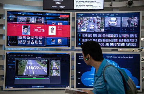A display for facial recognition and artificial intelligence is seen on monitors at Huawei's Bantian campus in Shenzhen, China, on April 26, 2019. (Kevin Frayer/Getty Images)