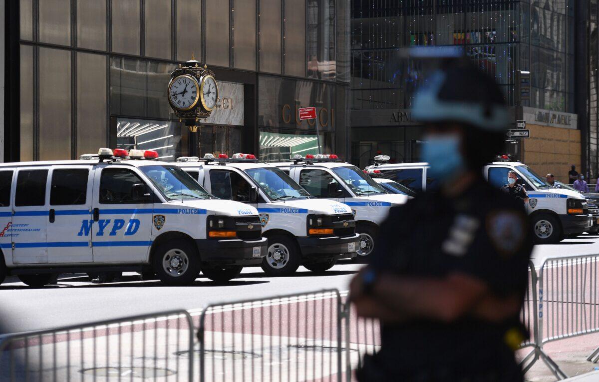 An NYPD officer stands guard on 5th Avenue in Manhattan on June 12, 2020. (Angela Weiss/AFP via Getty Images)