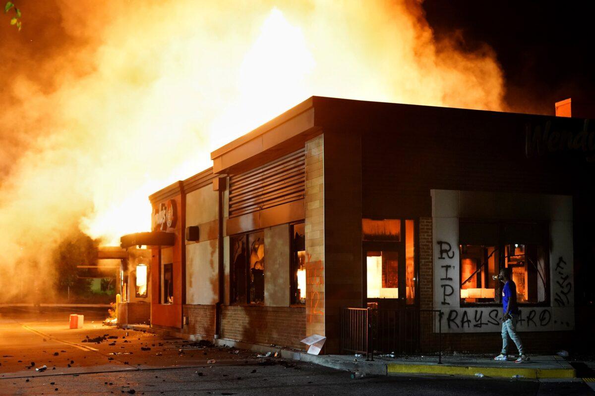 A Wendy’s burns following a rally against alleged racial inequality and the police shooting death of Rayshard Brooks, in Atlanta, Ga., June 13, 2020. (Elijah Nouvelage/Reuters)