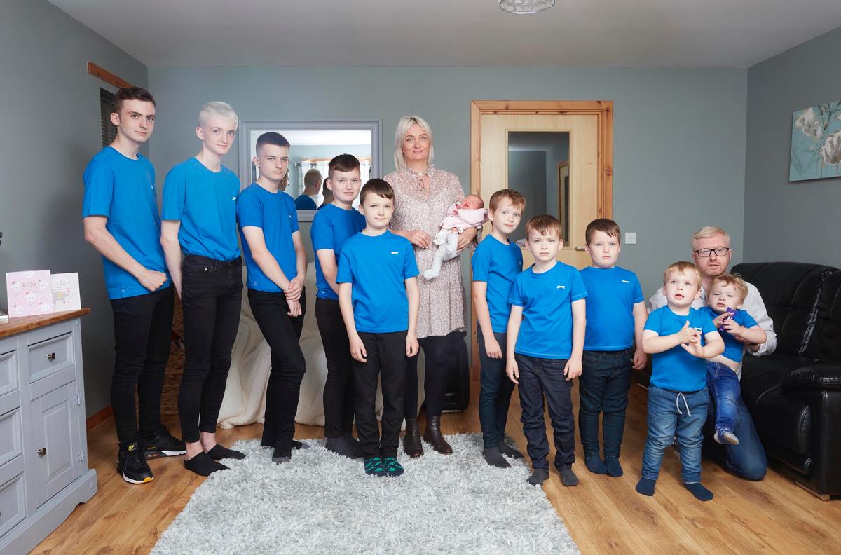 David and Alexis with all their 11 children. (Caters News)
