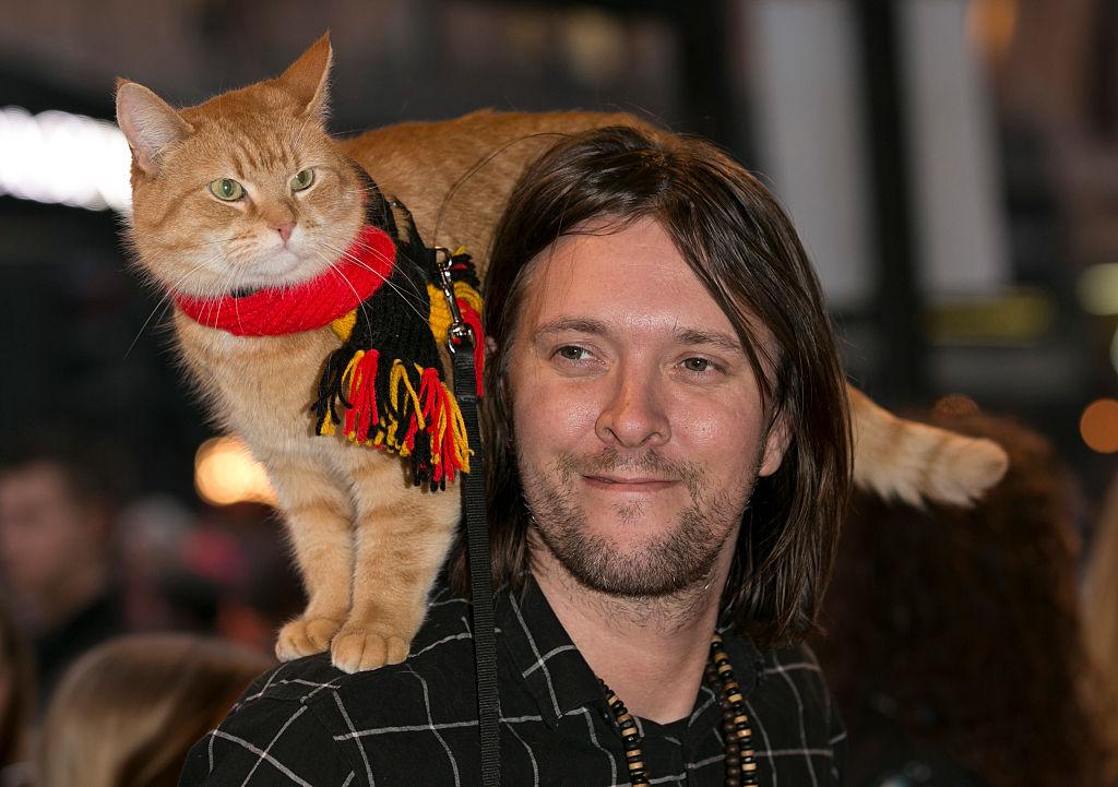 James Bowen and Bob the Cat arrive for Duncan Macmillan's new play "People, Places & Things" at The National Theatre on March 23, 2016, in London, England. (John Phillips/Getty Images)