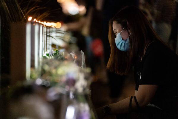 Mourners place flowers during a memorial vigil to commemorate the death of local protester Marco Ling-kit Leung at a shopping mall in Hong Kong, on June 15, 2020. (Anthony Kwan/Getty Images)
