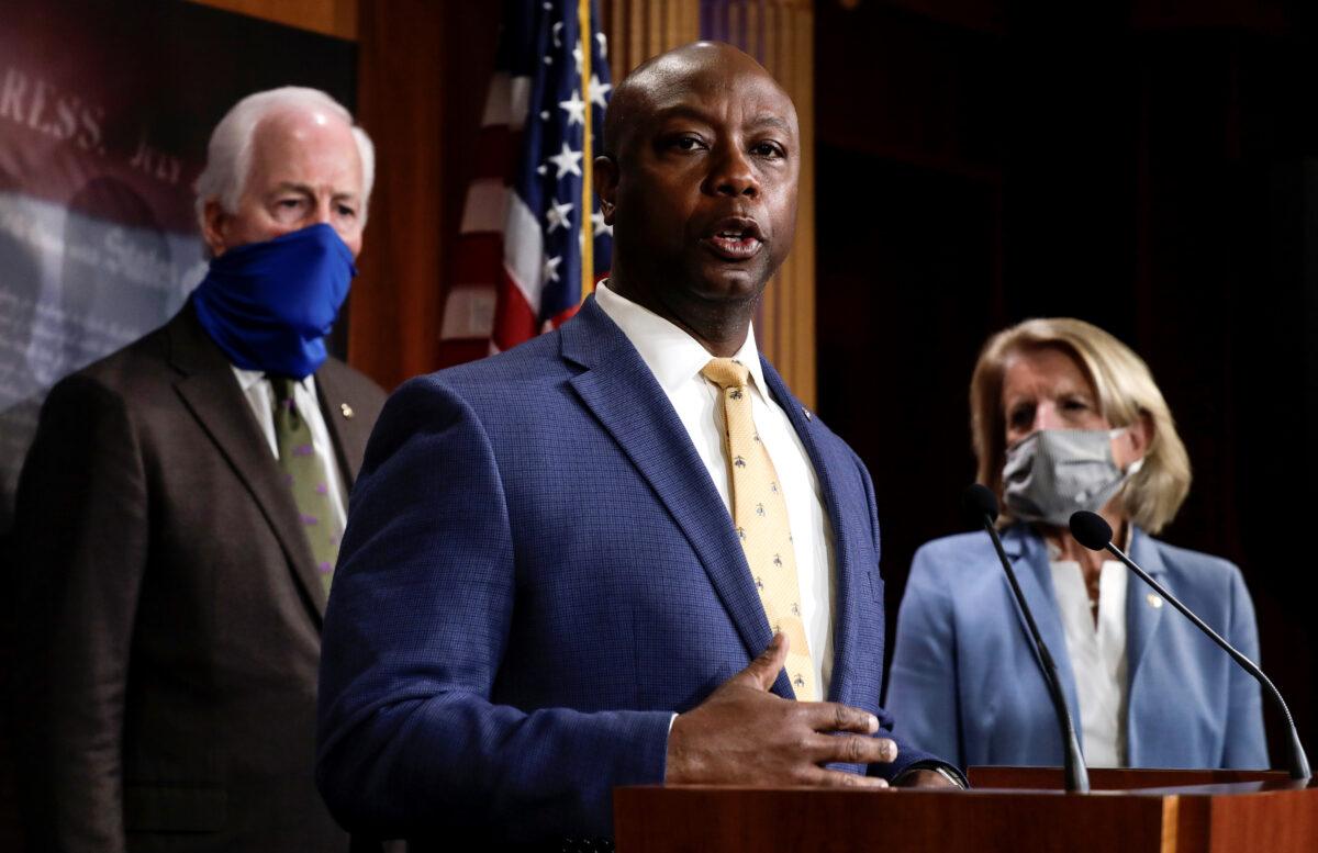 Sen. Tim Scott (R-S.C.) is flanked by Sens. John Cornyn (R-Texas) and Shelley Moore Capito (R-W.Va.) as he speaks about his new police reform bill unveiled by Senate Republicans during a news conference on Capitol Hill in Washington, on June 17, 2020. (Yuri Gripas/Reuters)