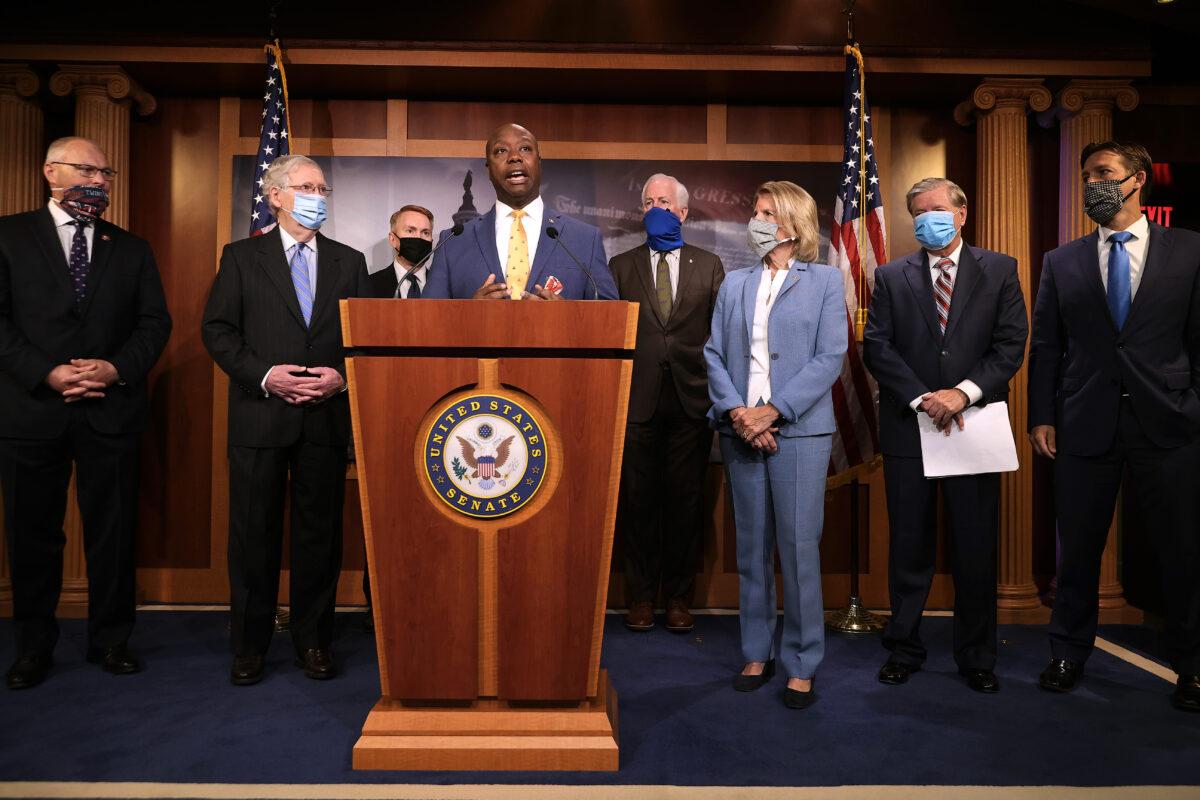 Sen. Tim Scott (R-S.C.) (C) is joined by (L-R) Rep. Pete Stauber (R-Minn.), Senate Majority Leader Mitch McConnell (R-Ky.), Sen. James Lankford (R-Okla.), Sen. John Cornyn (R-Texas), Sen. Shelley Moore Capito (R-W.Va.), Senate Judiciary Committee Chairman Lindsey Graham (R-S.C.) and Sen. Ben Sasse (R-Neb.) for a news conference to unveil the GOP's legislation to address racial disparities in law enforcement at the U.S. Capitol in Washington, on June 17, 2020. (Chip Somodevilla/Getty Images)