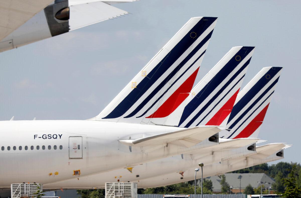 Air France Boeing 777 planes sit on the tarmac at Paris Charles de Gaulle airport in Roissy-en-France during the outbreak of CCP virus in France, on May 25, 2020. (Charles Platiau/Reuters)