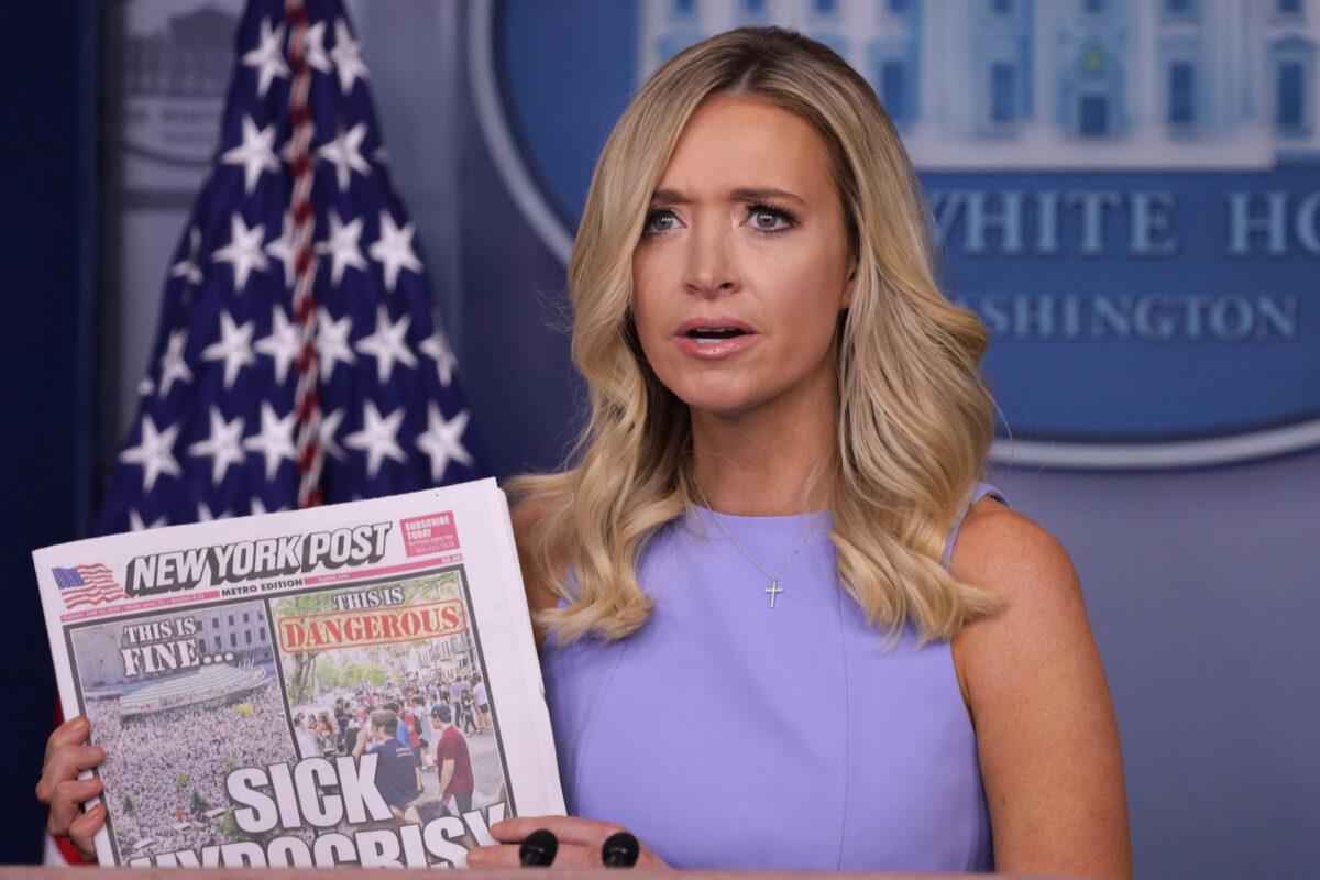White House Press Secretary Kayleigh McEnany holds up a copy of the New York Post during a news briefing at the White House in Washington on June 17, 2020. (Alex Wong/Getty Images)