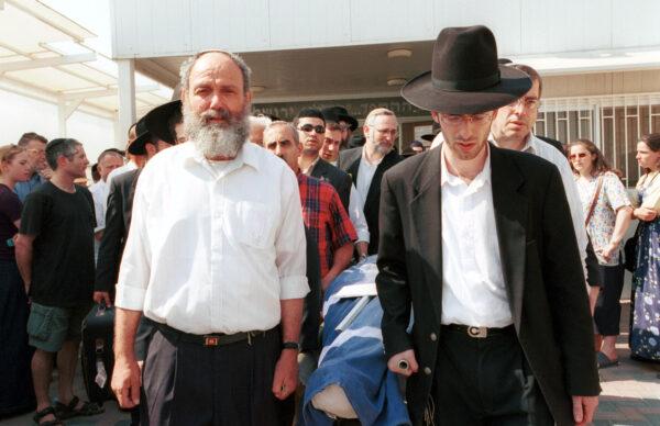 Family and friends attend a funeral service for Shoshanna Greenbaum, an American-Jewish woman, who was four months pregnant when she was killed in Jerusalem, Israel, on Aug. 10, 2001. (Courtney Kealy/Getty Images)