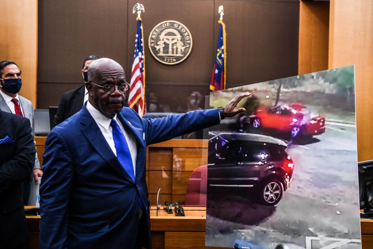 Fulton County District Attorney Paul Howard point at a picture displayed inside the courtroom as he announces 11 charges against former Atlanta Police Officer Garrett Rolfe in Atlanta, Ga., on June 17, 2020. (Chandan Khanna/AFP via Getty Images)