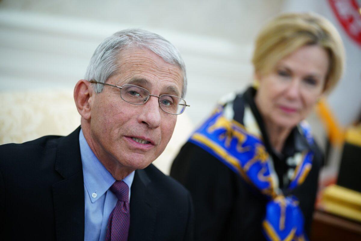 Dr. Anthony Fauci, left, director of the National Institute of Allergy and Infectious Diseases speaks in the Oval Office of the White House in Washington on April 29, 2020. (Mandel Ngan/AFP via Getty Images)