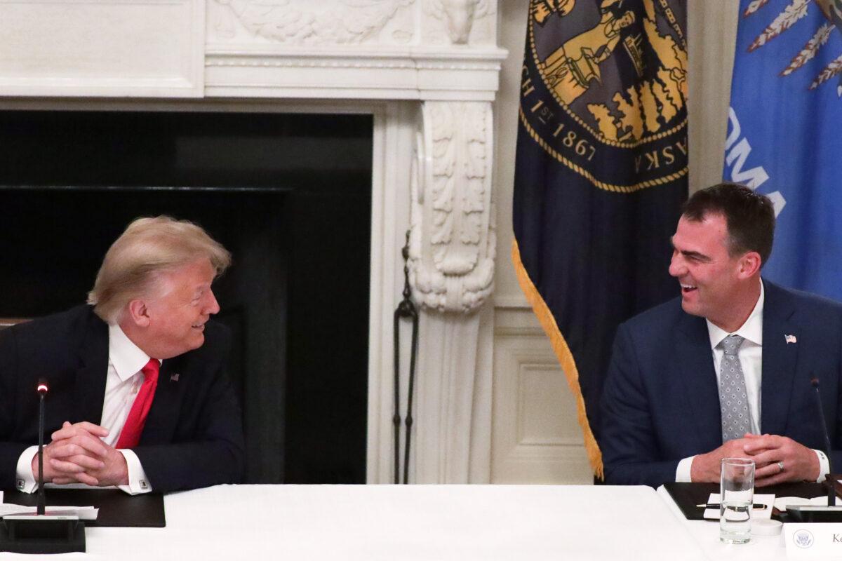 President Donald Trump listens as Oklahoma Governor Kevin Stitt speaks during a roundtable at the State Dining Room of the White House in Washington on June 18, 2020. (Alex Wong/Getty Images)
