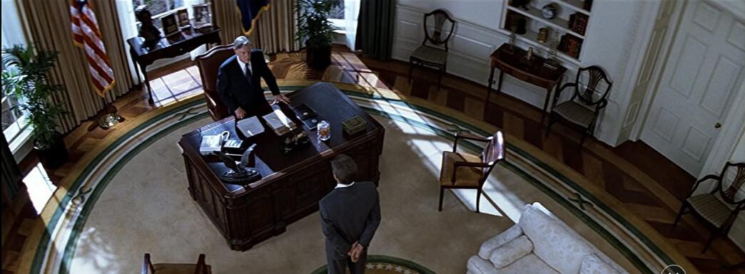 President Bennett (Donald Moffat, L) and Jack Ryan (Harrison Ford) in the Oval Office, in "Clear and Present Danger." (Paramount Pictures)