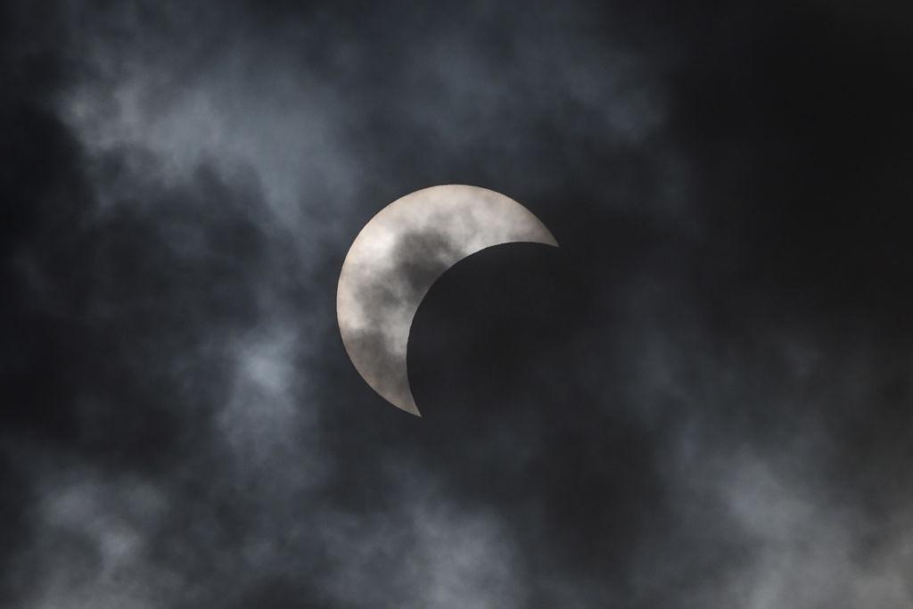 This picture shows the Moon passing in front of the Sun during an annular solar eclipse in Manila on June 21, 2020. (TED ALJIBE/AFP via Getty Images)