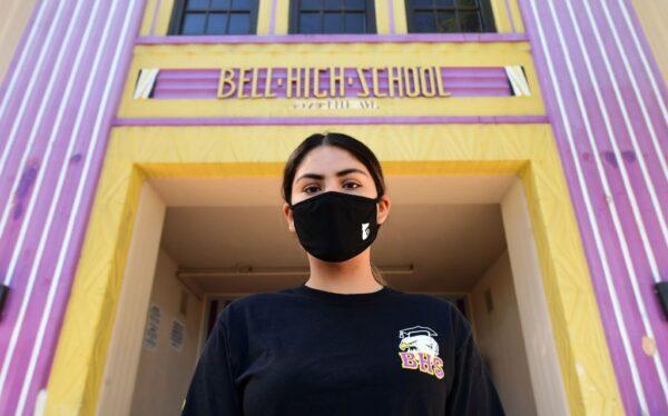 Bell High School senior Kenia Molina in front of her school, closed due to the COVID-19 pandemic, in Bell, Calif., on April 15, 2020. (Frederic J. Brown/AFP via Getty Images)