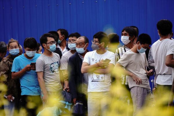 Residents who visited or live near Xinfadi Market line up for a nucleic acid test in Beijing, China on June 19, 2020. (Lintao Zhang/Getty Images)