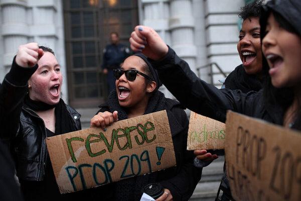 Students hoping for a repeal of California's Proposition 209 hold signs outside of the U.S. 9th Circuit Court of Appeals in San Francisco, on Feb. 13, 2012. (Justin Sullivan/Getty Images)