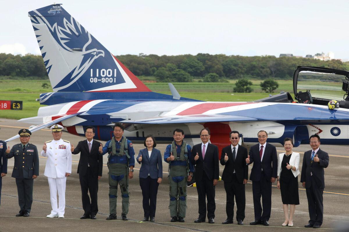 Taiwanese President Tsai Ing-Wen poses for a photo in front of the AIDC T-5 Brave Eagle, Taiwan's first locally manufactured advanced jet trainer, in Taichung, Taiwan, on June 22, 2020. (Ann Wang/Reuters)