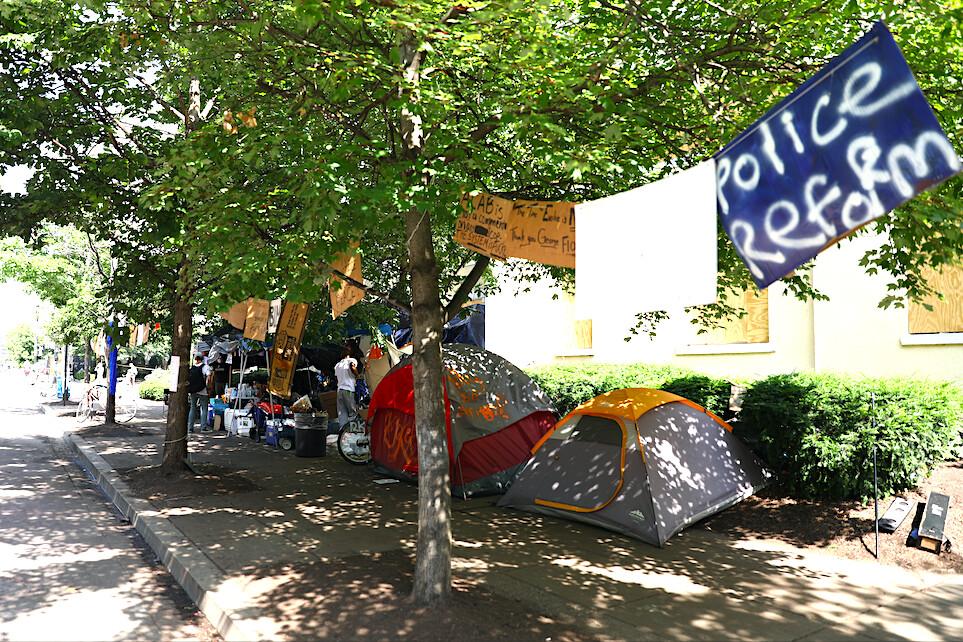 Tents line the sidewalk just before police clear H Street and Black Lives Matter Plaza after protesters set up an autonomous zone the previous night, just north of the White House in Washington on June 23, 2020. (Charlotte Cuthbertson/The Epoch Times)