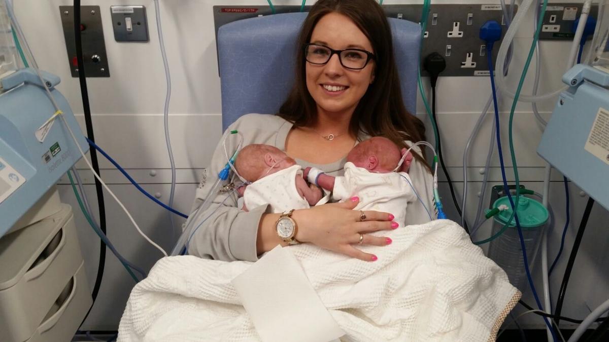 Luci holding both her twins. (Caters News)